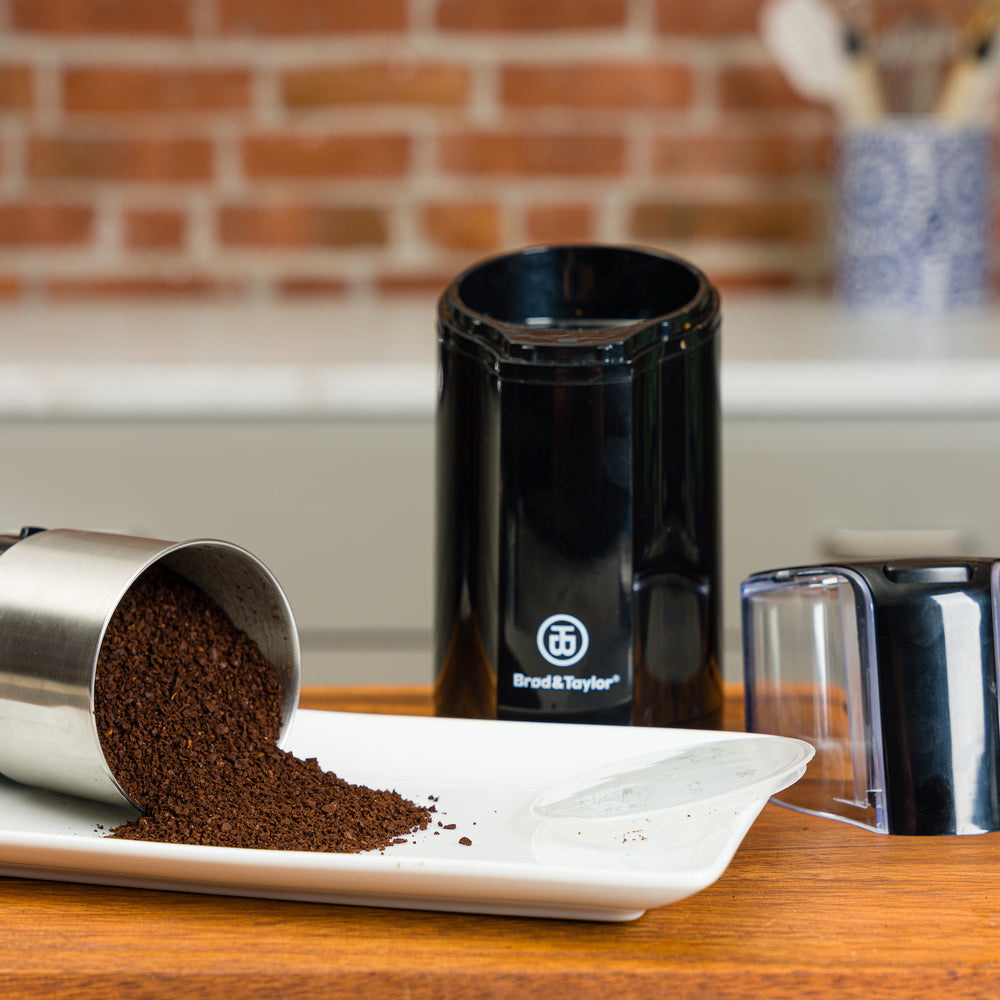 Ground coffee beans and the Spice & Coffee Grinder