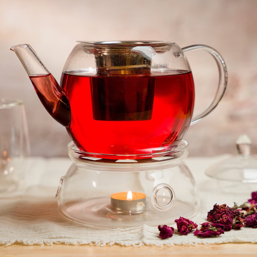 Glass teapot with the Mesh Tea Infuser Basket steeping rose bud tea