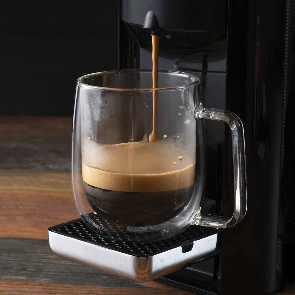Glass mug with a coffee maker